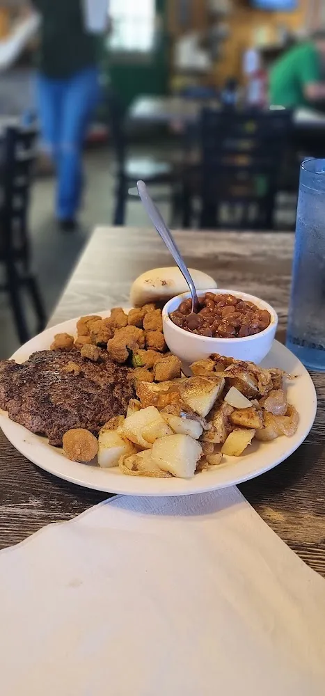 Hamburger Steak Baked Beans Fried Okra and Fried Potatoes with Onions